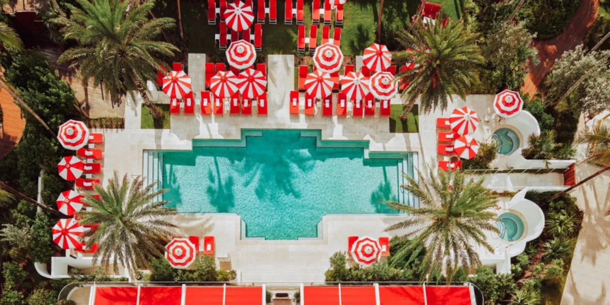 Faena Hotel Miami Beach aerial view of pool with iconic red and white umbrellas
